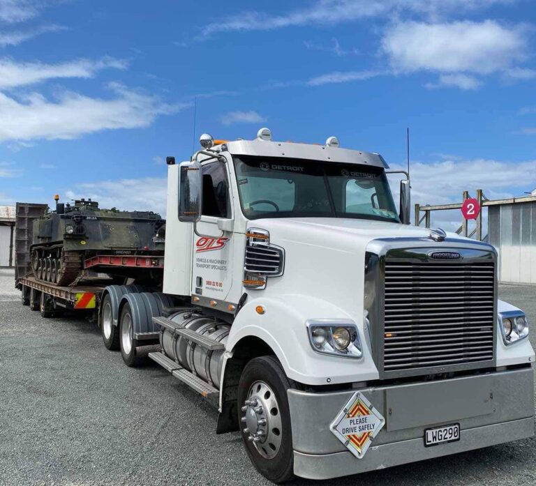 OTS Truck with military machine being transported