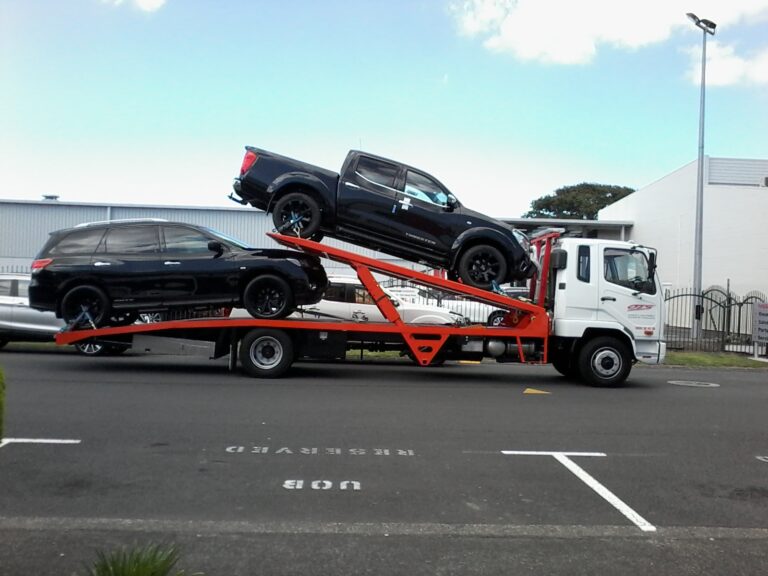 Tow truck transport two SUVs