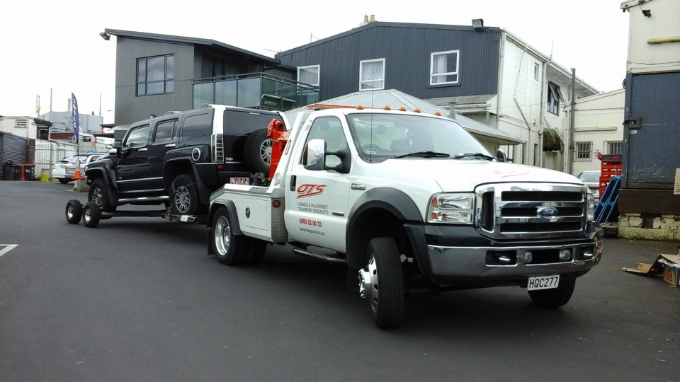 OTS Truck towing old truick