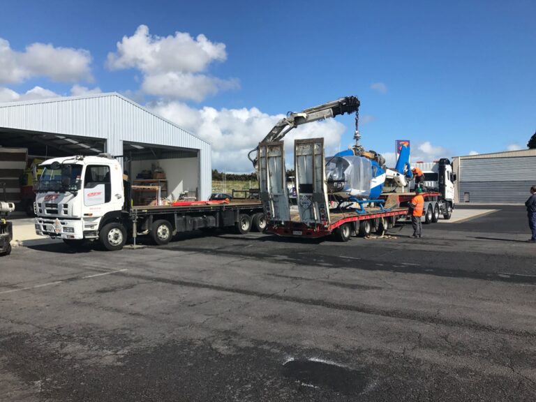 OTS trucks transporting and hiabing helicoper