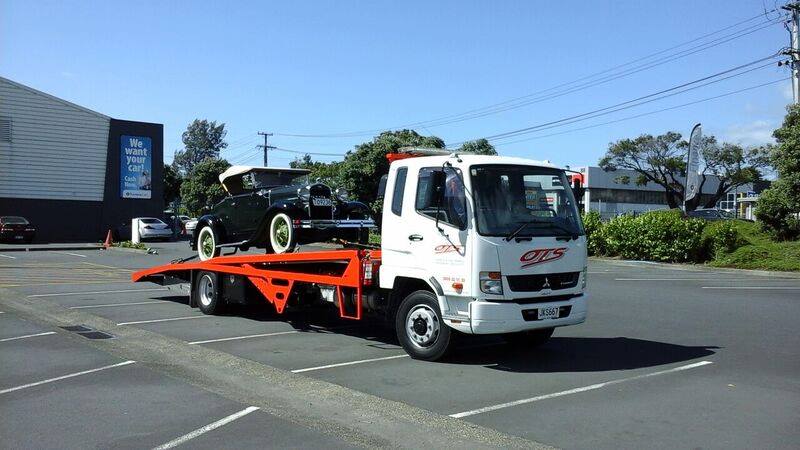 Onehunga towing service truck transporting vintage car