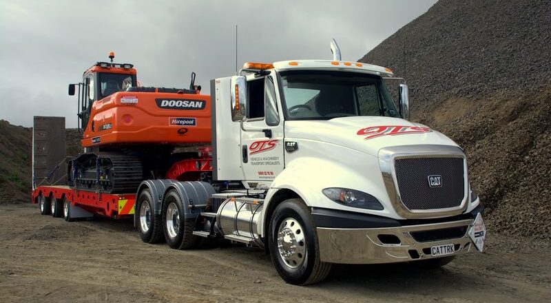 Large OTS truck carry digger in gravel area