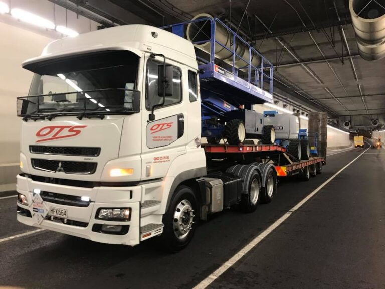 OTS - Onehunga Towing Services Truck driving with two machines in tunnel