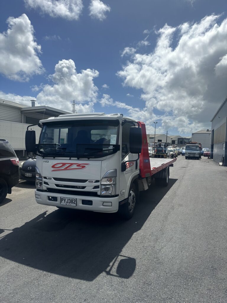 OTS Onehunga towing flat bed truck