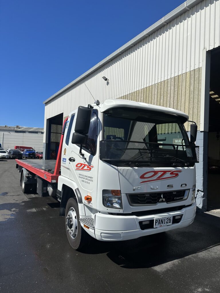Clean OTS onehunga towing flat bed truck