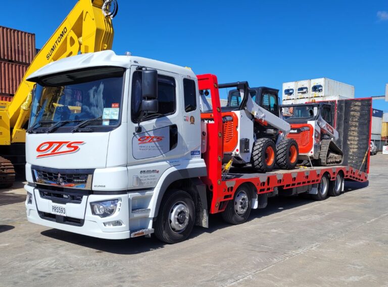 Onehunga Towing Service Trucking carrying two bob cats